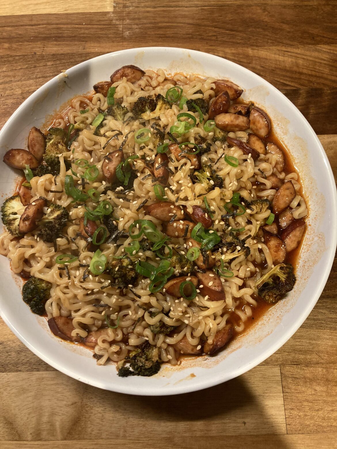 Buldak X2 noodles with sausage, garlic broccoli & spring onions(scallions). Will get rid of this cold!