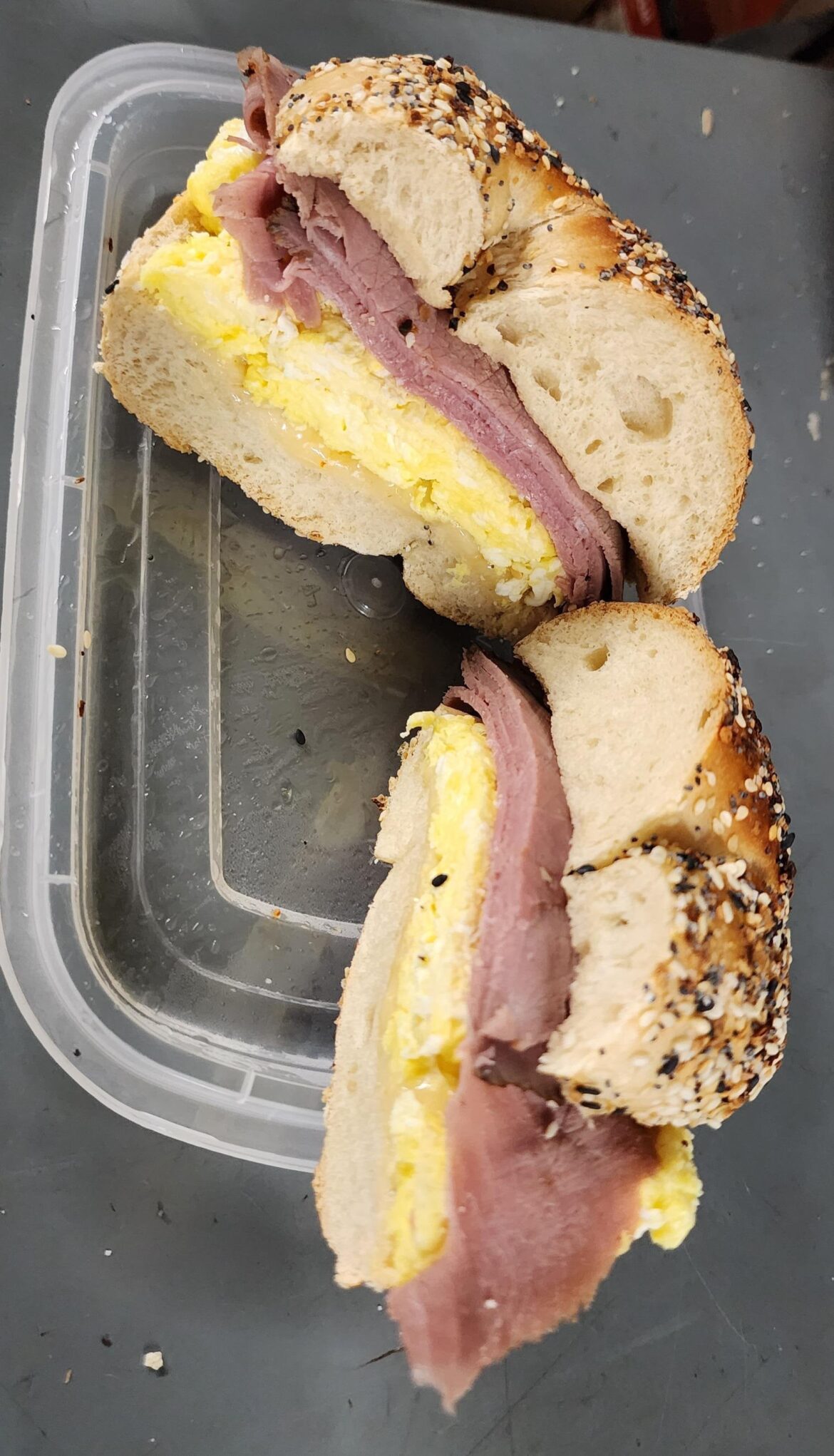 It tastes better than my photo looks! Everything bagel, garlic roast beef, egg, Carolina reaper cheese.