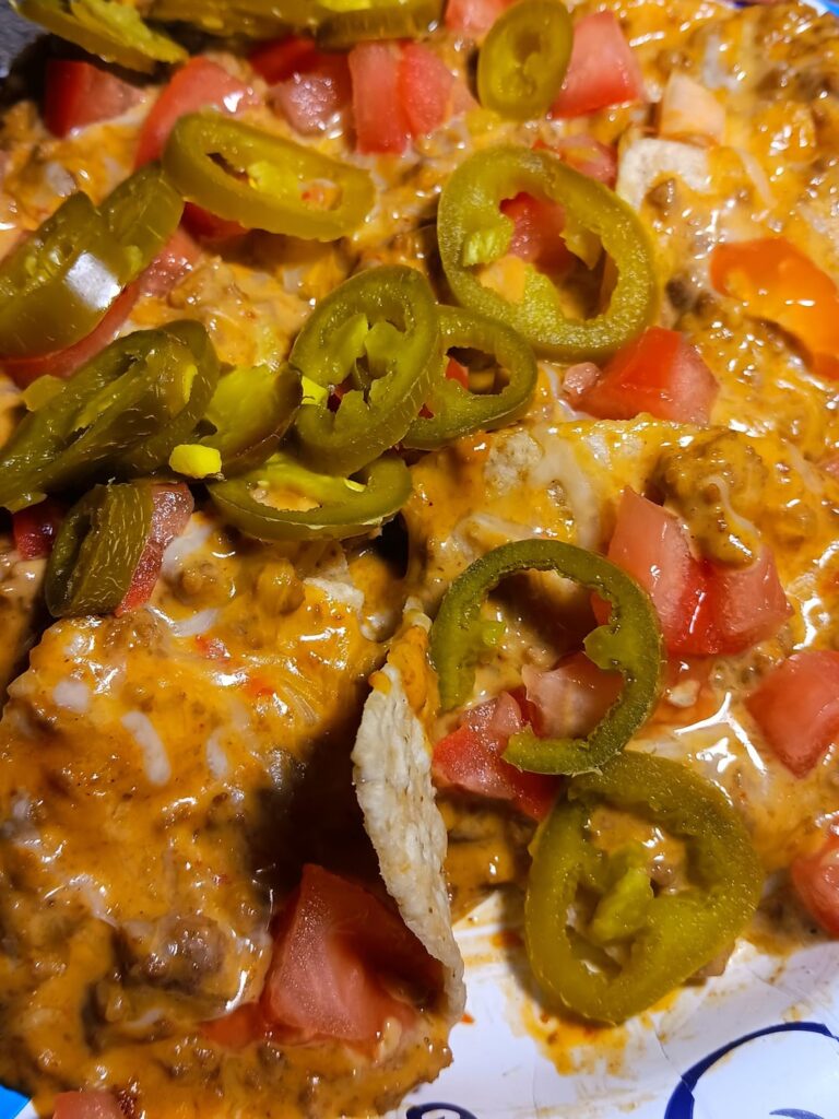 My insides are already bubbling. Tostitos queso with ground beef.