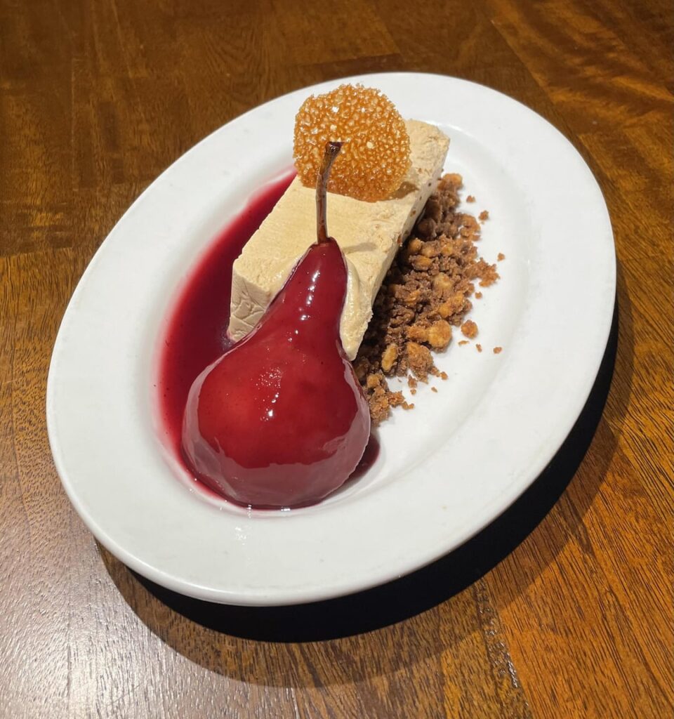 Poached pear, burnt honey semifreddo, walnut streusel