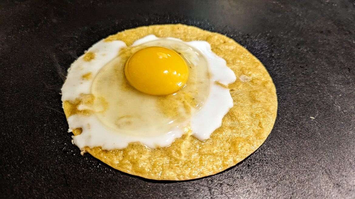 Cooking an egg on a tortilla