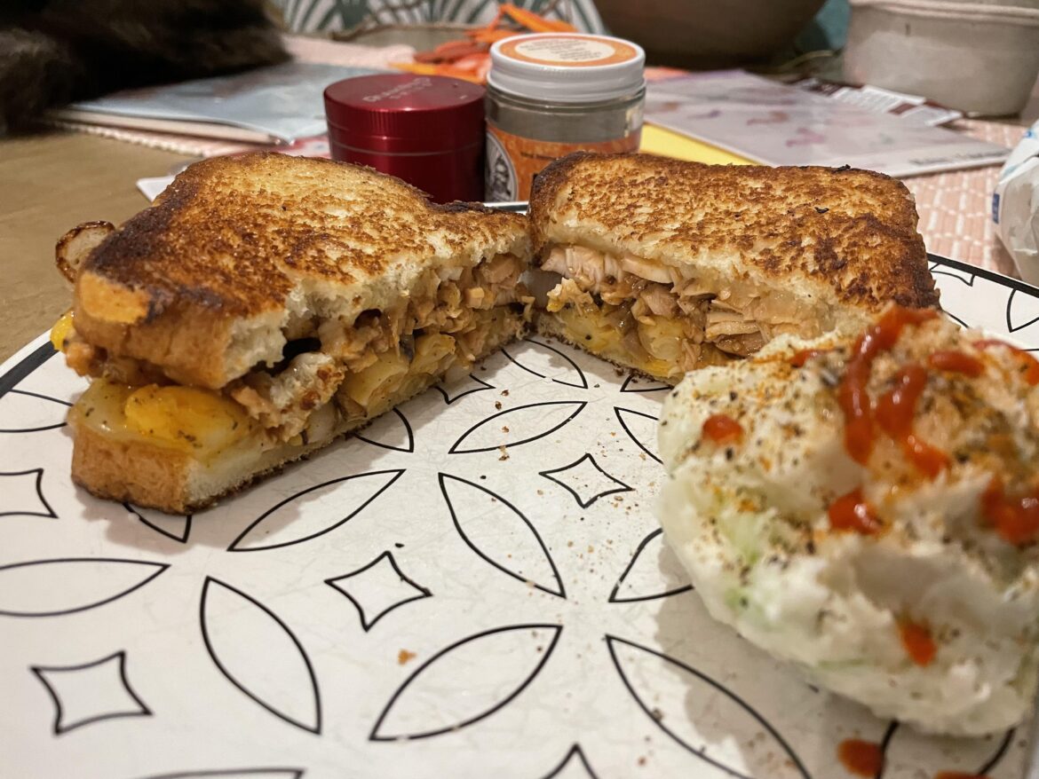 BBQ chicken on a grilled cheese with cheddar, velveeta shells and grilled onions. Side of potato salad.