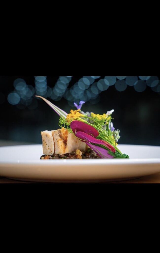 Sous Vide Chicken Breast with Local Herb Bouquet / Beluga Lentil / Pink Guava Butter Sauce