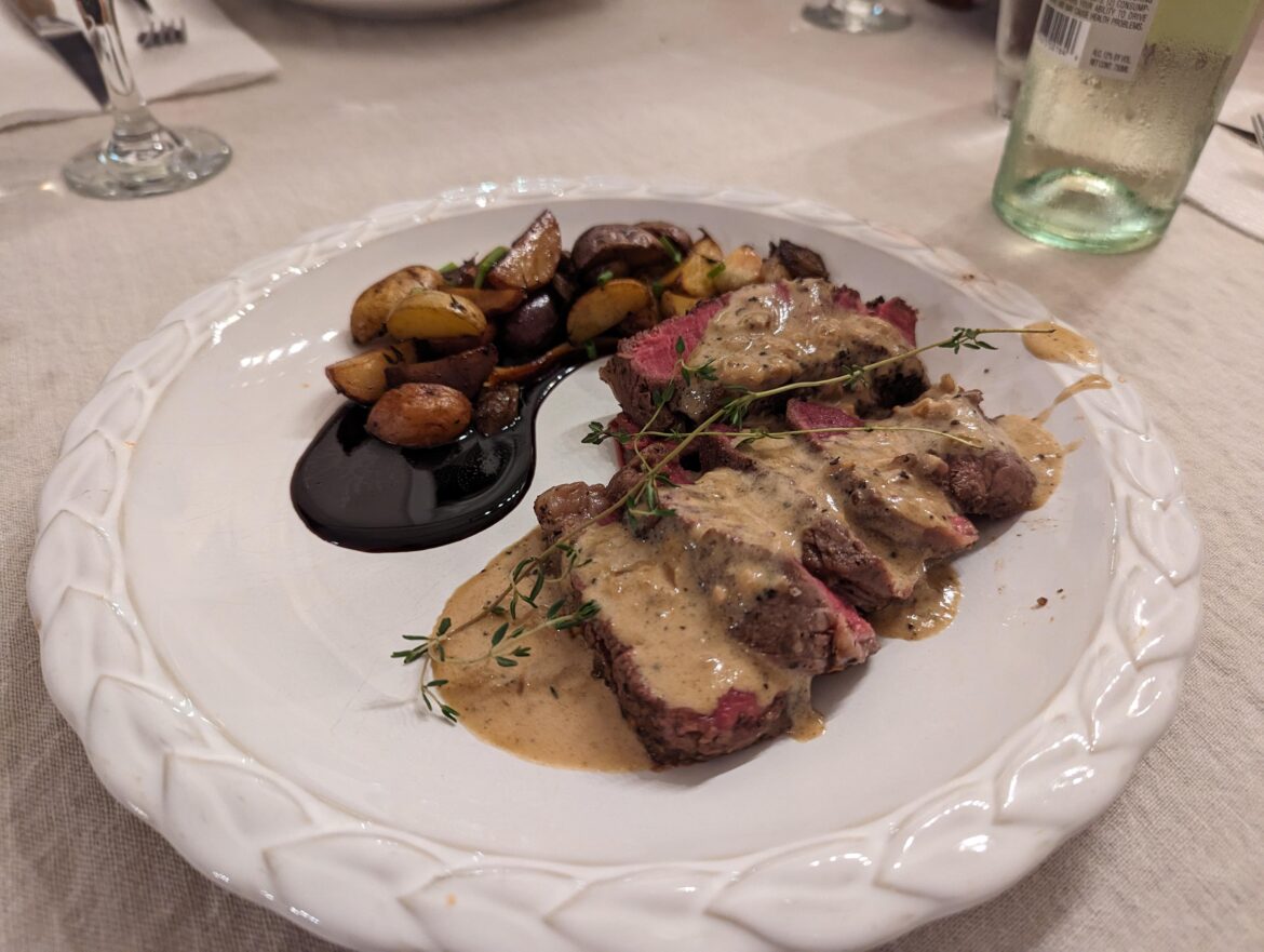 Steak au Poivre with balsamic glazed pearl onions, assorted potatoes, and garlic. Topped with thyme and chives respectively. Home cook. Thoughts?