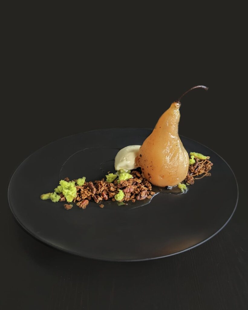 Poached Pear in a Spiced Syrup, Cardamon Moss, Brown Sugar Pecan Granola, Vanilla Ice Cream