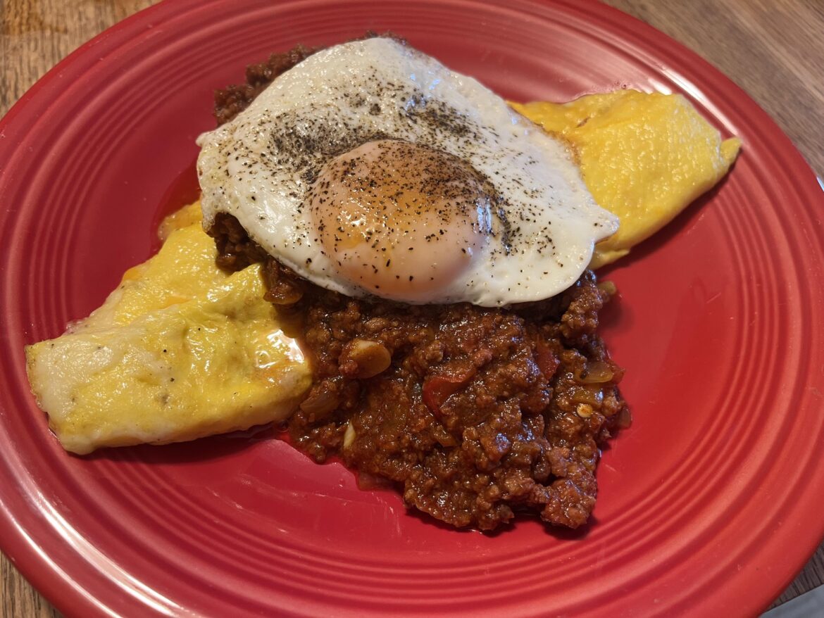 It’s either insanity or genius, I’ll let you decide. An egg on top is the best way to have an omelet imo. 2 egg 3 cheese omelet, smoked chili and an egg on it.
