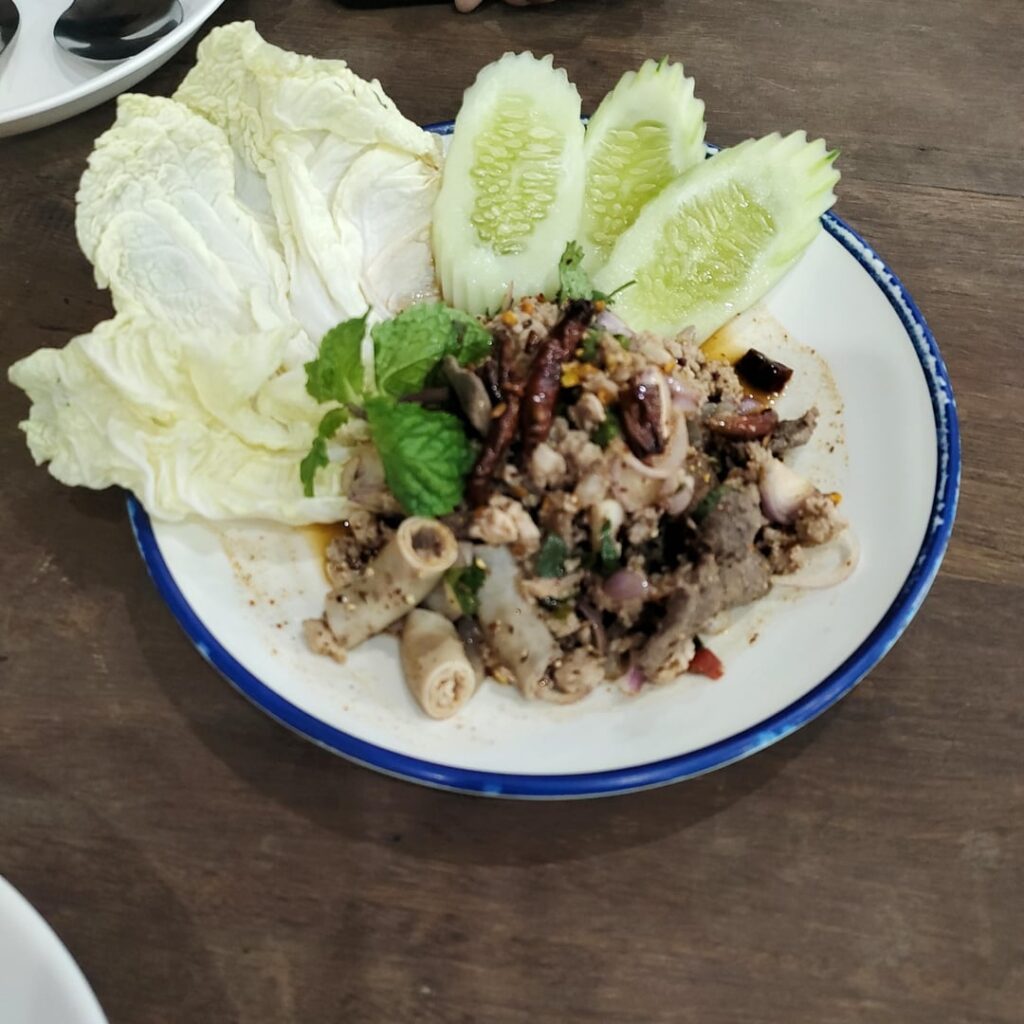 On the road again. Lunch today at ladyboy Cafe. Mo pork, fish soup, clam som-tam.