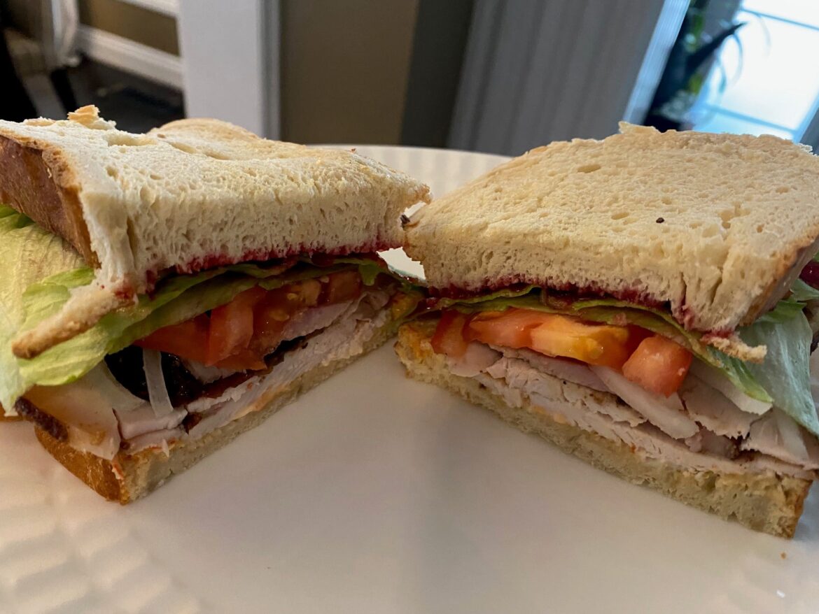 Post Thanksgiving sandwich - Smoked turkey, lettuce, tomato, onion, cranberry sauce, mayo and scorpion hot sauce