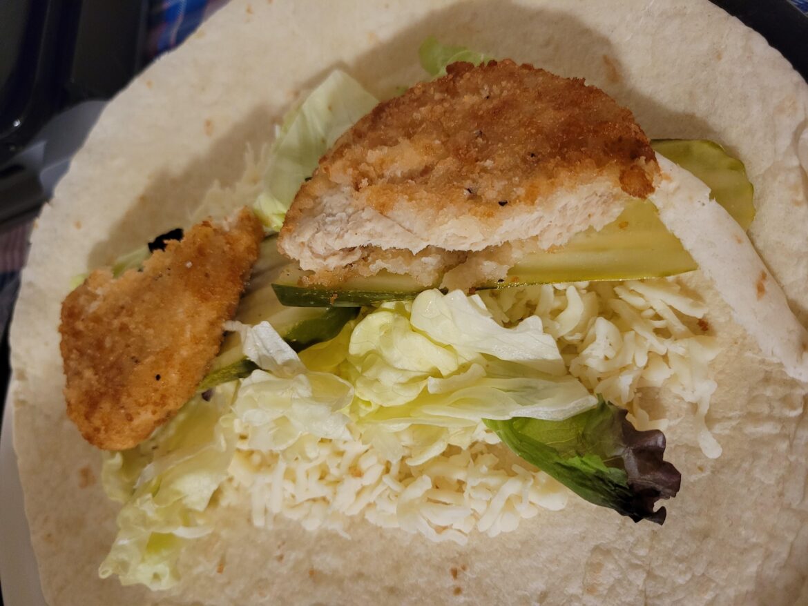 Making a veggie chicken wrap.