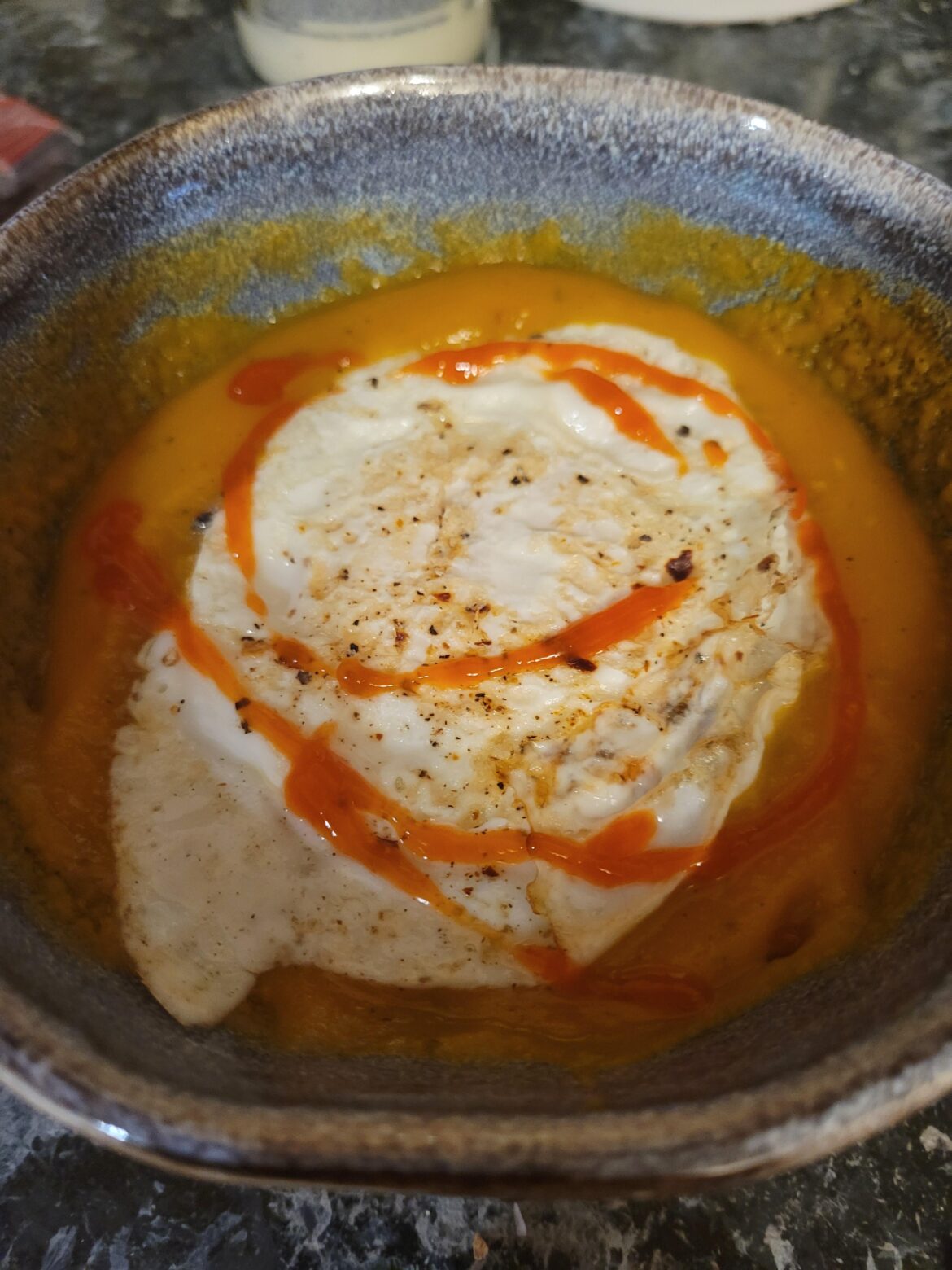 Overeasy on butternut squash soup