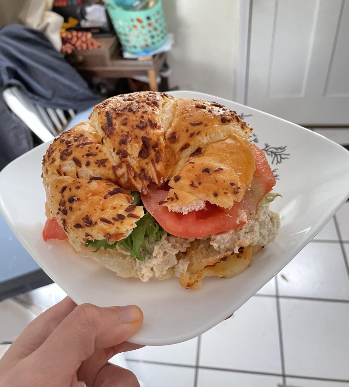 Asiago croissant, chicken salad sandwich with tomato and lettuce
