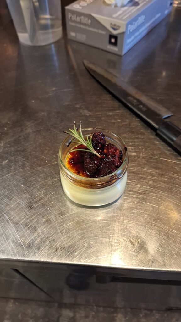 Gin and goat cheese crème brûlée, blackberry compote, burnt rosemary