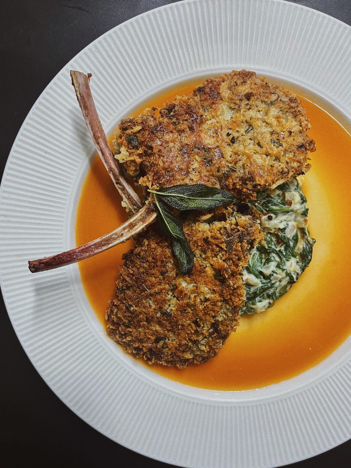 Parmesan Crusted Lamb Chops, Bed of Creamed Spinach, Tomato, Sage and White Wine Sauce