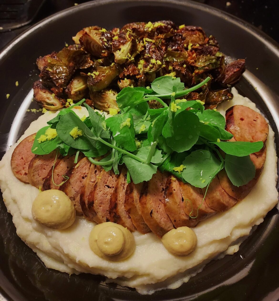 Italian sausage, roasted garlic cauliflower pureé, dijon, honey/garlic butter (c r i s p y) brussels w/ lemon zest & balsamic glaze, pea greens w/ lemon juice/zest.