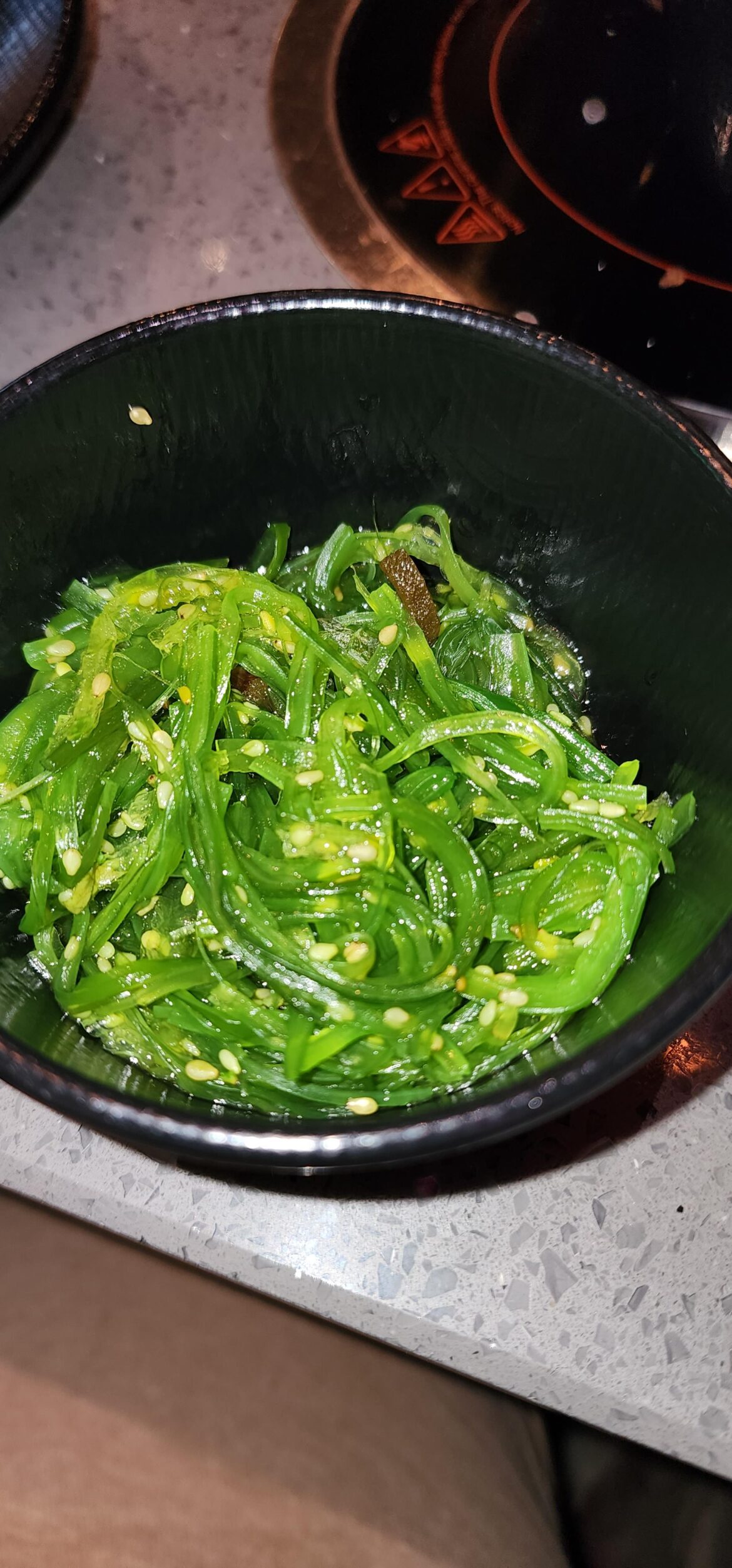 What is this? It was at korean BBQ. Next to the kimichi and sauces, not spicy & has seasme seeds.