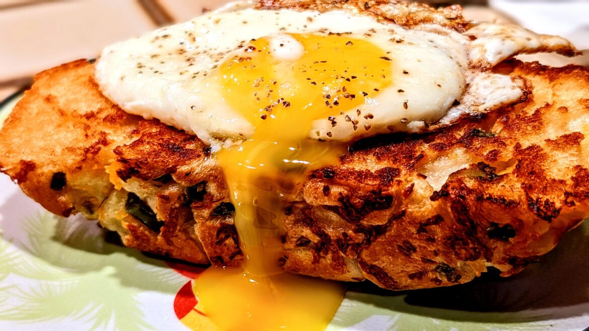 Egg on a slice of fried jalapeno chopped bread