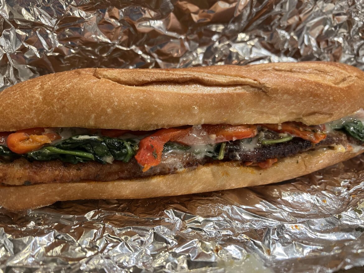 Leftover chicken cutlet with provolone, sautéed spinach, roasted red pepper on a local fresh roll (Philly area)