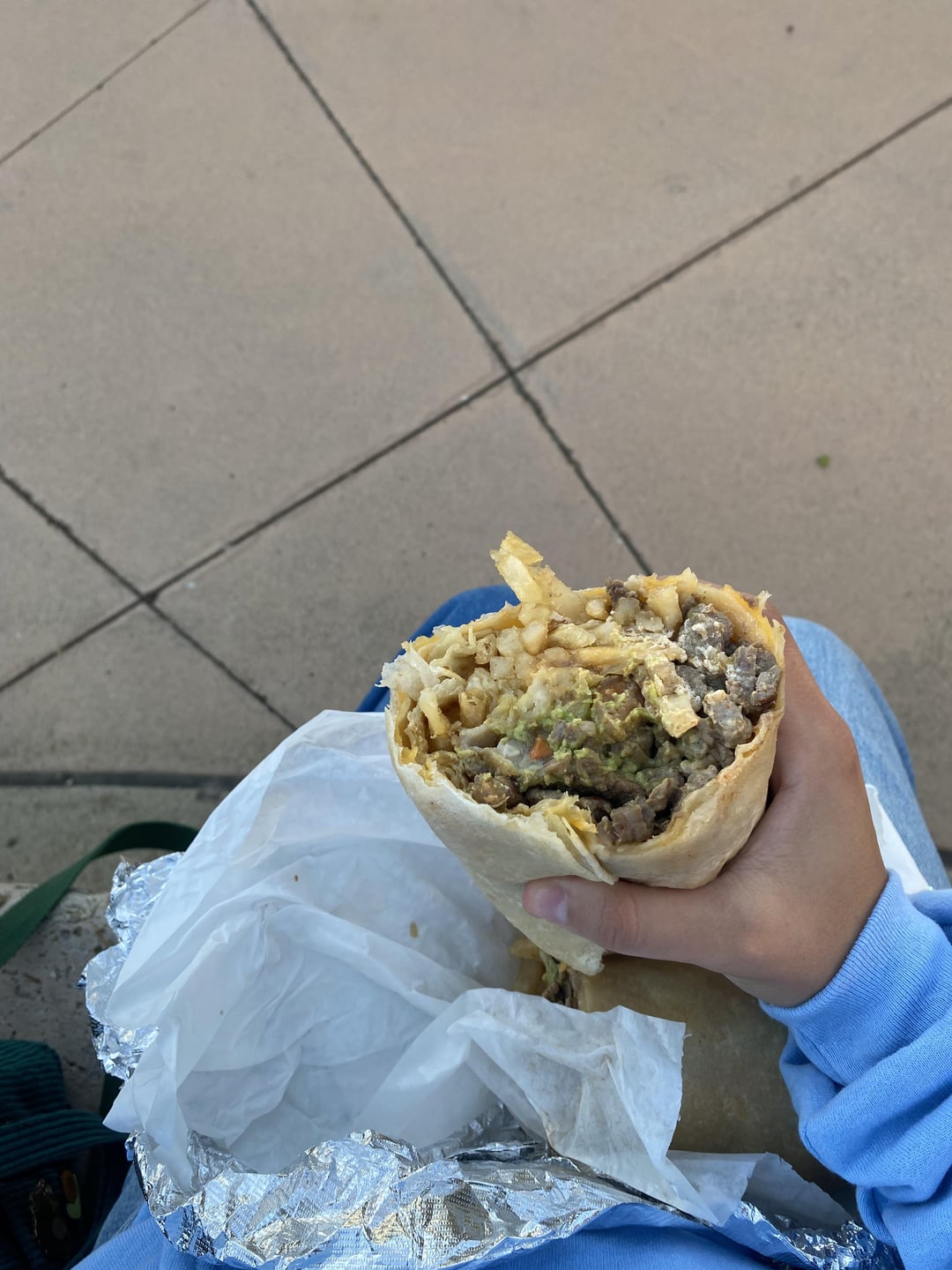 Calories for this whole burrito? I’m holding half of it here. Menu