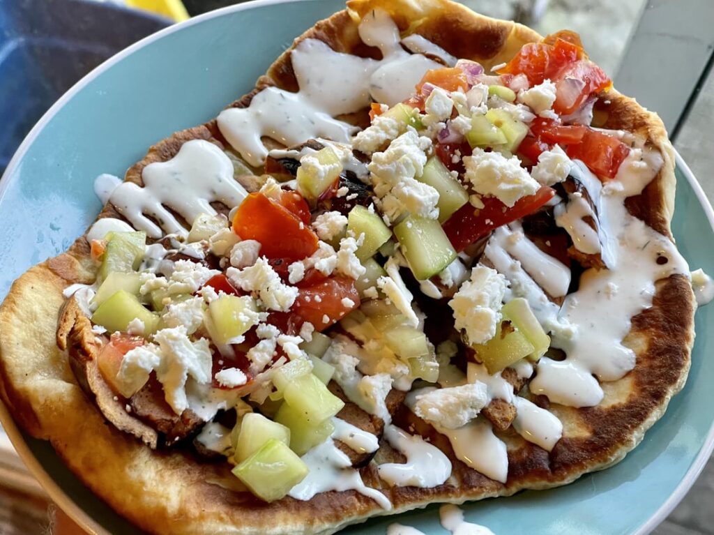 Lamb sausage gyros on home made pita, yogurt sauce