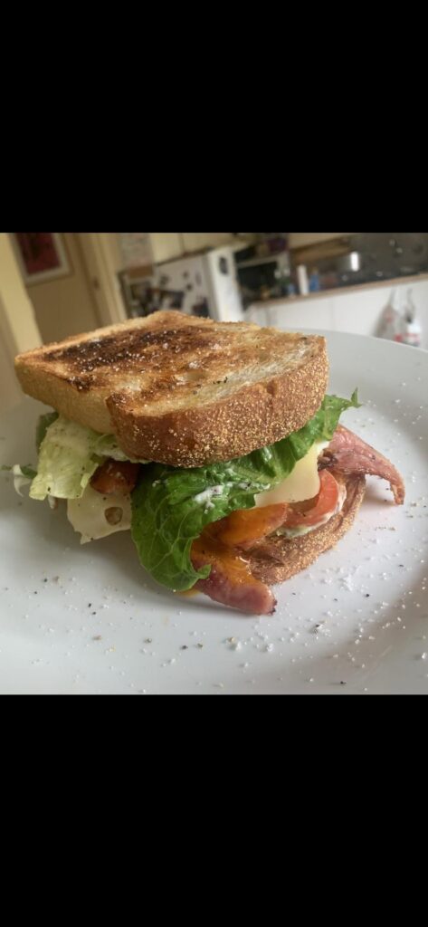 BLEAT on toasted corn sourdough with swiss & mayo