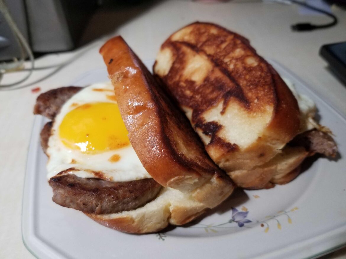 Fresh sausage patties and jumbo sunny-up egg on buttered and grilled NE Style Brioche Hot Dog Buns. This is why I'm not vegan.