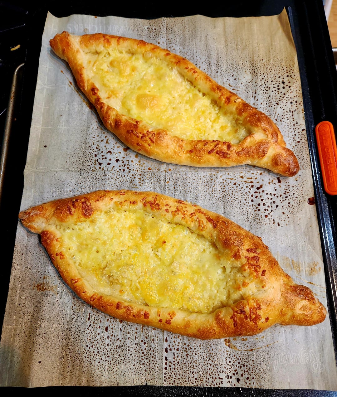 [Homemade] Khachapuri with brie, white cheddar, sausage gravy, egg