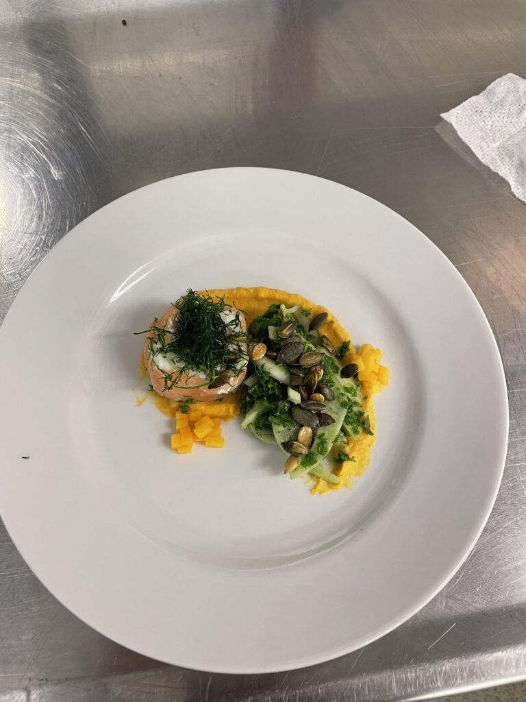 cold smoked salmon with horseradish and cream cheese, fried dill, roasted pumpkin puree, pickled pumpkin, pumpkin seeds, fennel and kale salad