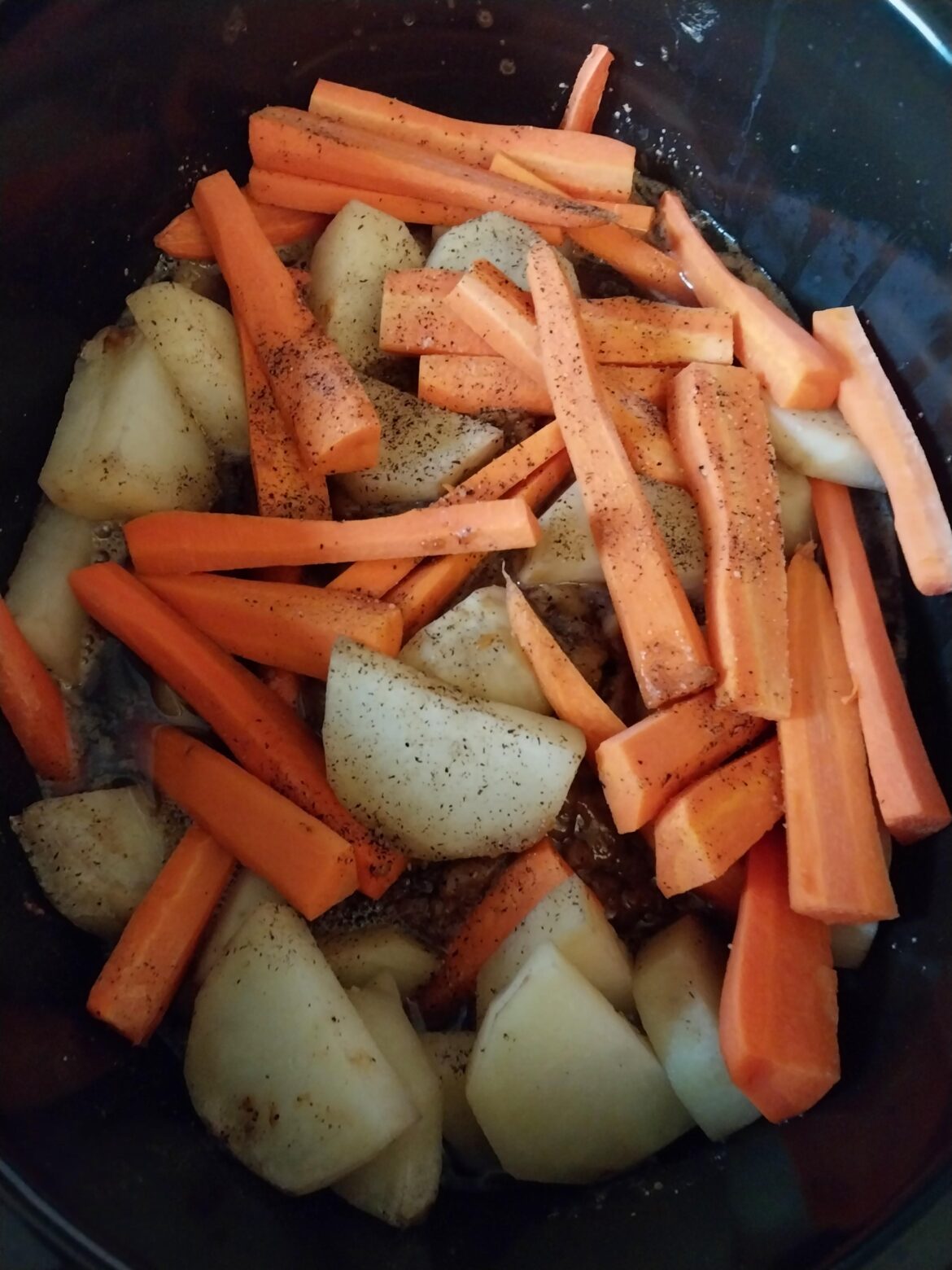 London Broil with potatoes and carrots. Can't wait until it's done. This picture captures it's progress at the 4 hour mark of a 6 hour slow and low cook.