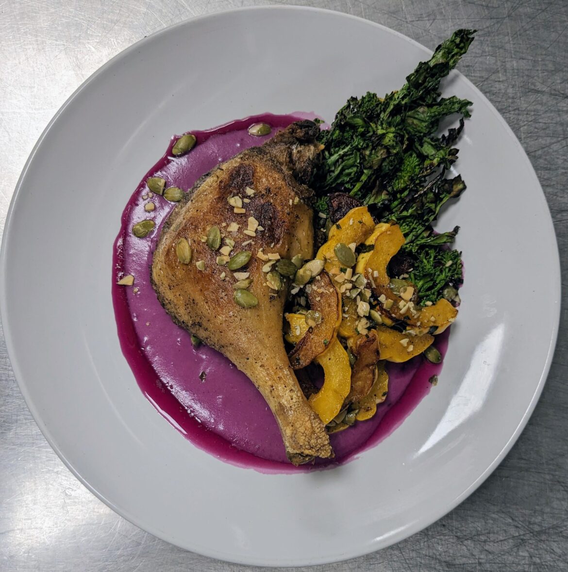 Duck Confit, Purple Sweet Potato Aligot, Charred Broccoli Rabe, Squash, Huckleberry-Herb Gastrique