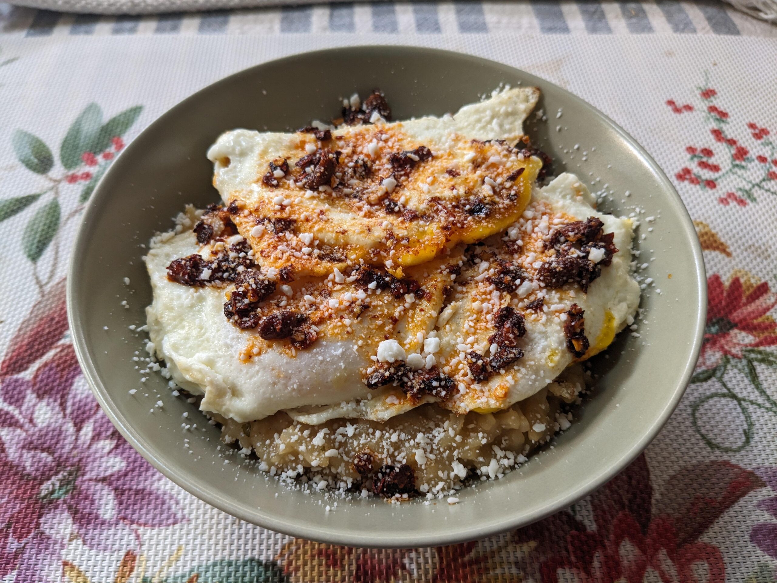 Eggs + Congee w/ Chili Crisp and Cotija Cheese Dining and Cooking