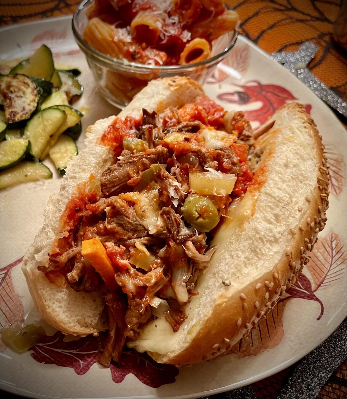 Homemade shredded beef, provolone, mozzarella, Parmigiano-Reggiano, hot giardiniera, and marinara on a fresh Italian roll.