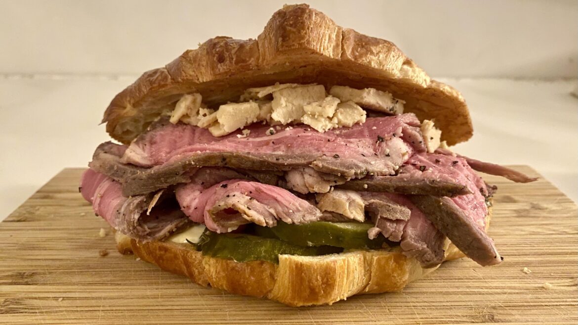 Leftover Thanksgiving roast tri-tip, dill pickles, caramilized-onion cheddar, kewpie mayo on a butter croissant.