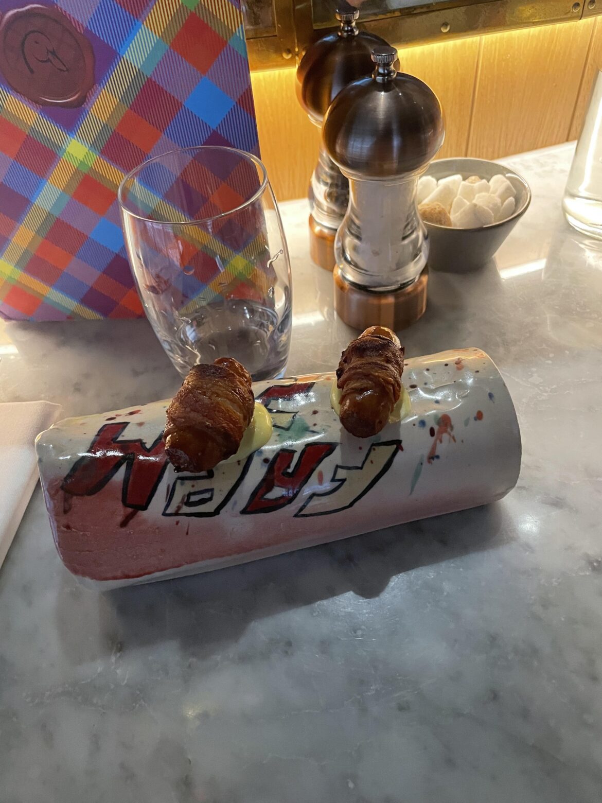 Pigs in blankets on a ceramic log