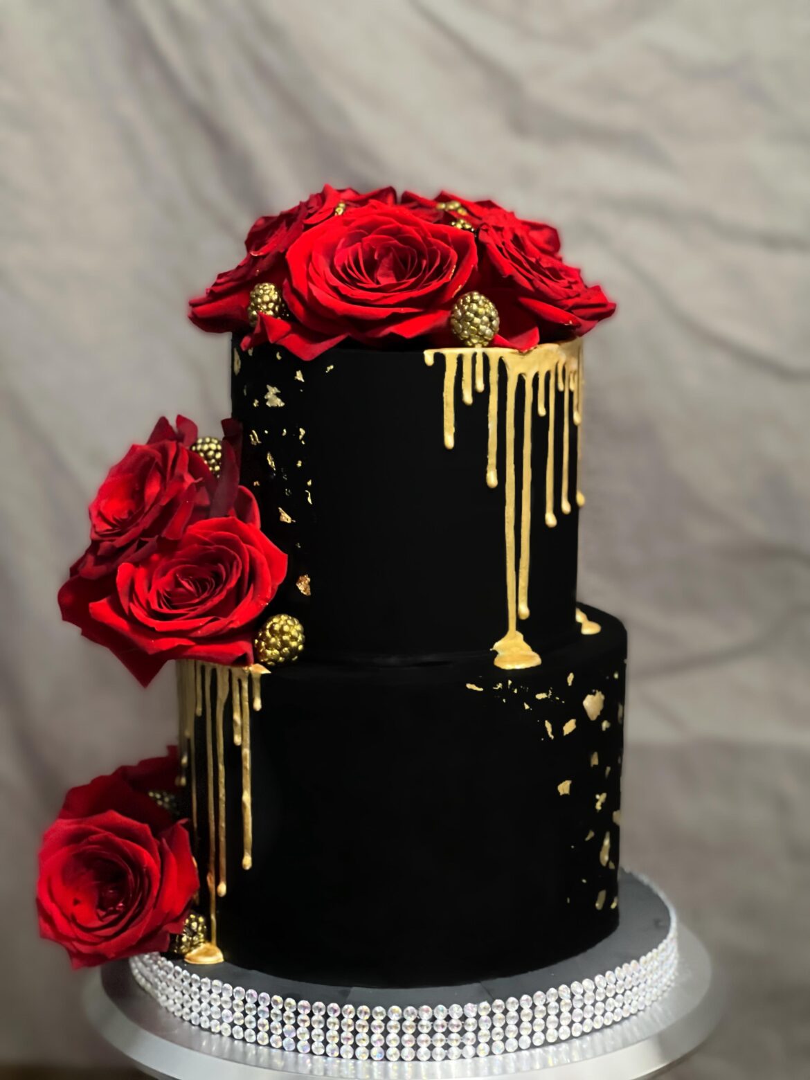 Vanta black buttercream cake. I even made the cake board, and manipulated the roses.