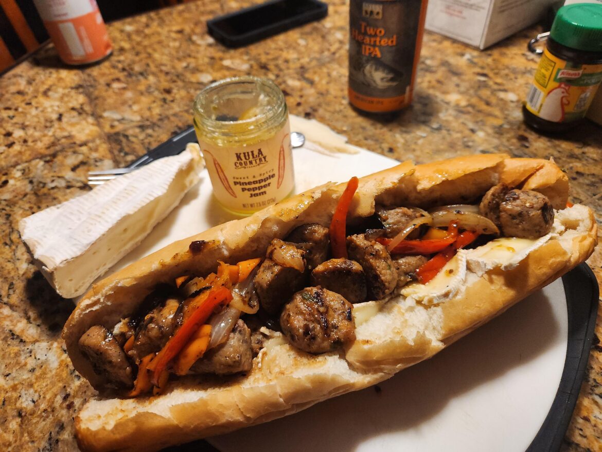 Cranberry Jalapeno meatballs, peppers, and onions, glazed in stock and pineapple pepper jam with Brie.