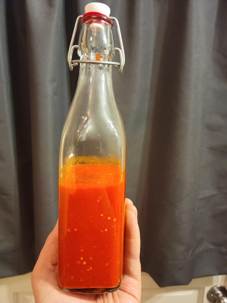 My first homemade hot sauce- fermented red habanero with garlic and fish sauce.