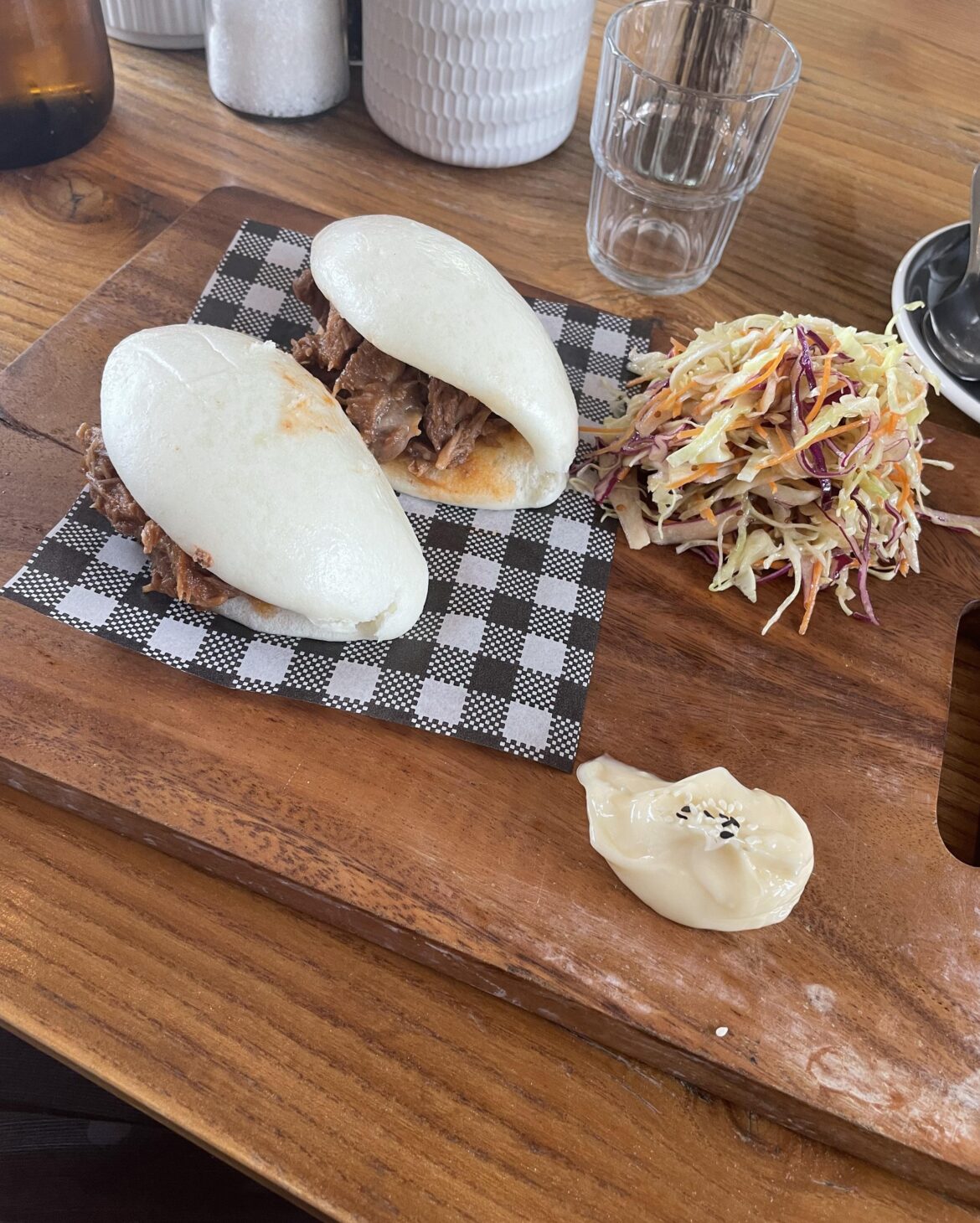Pork Bao and Coleslaw served on a chopping board