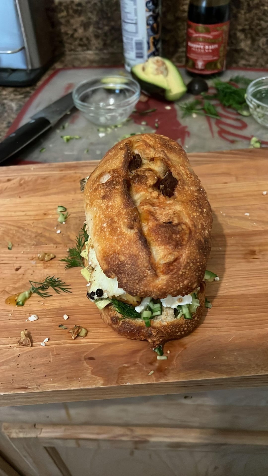 Breakfast sandwich on bacon lardon and Gruyère bread with dressed