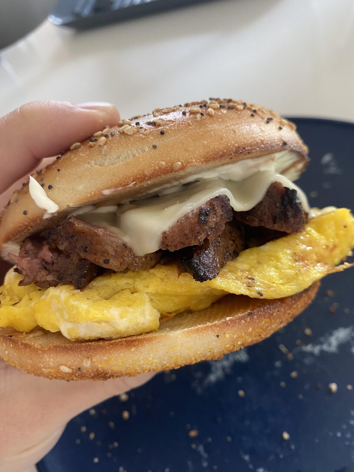 Steak egg and cheese on an everything bagel