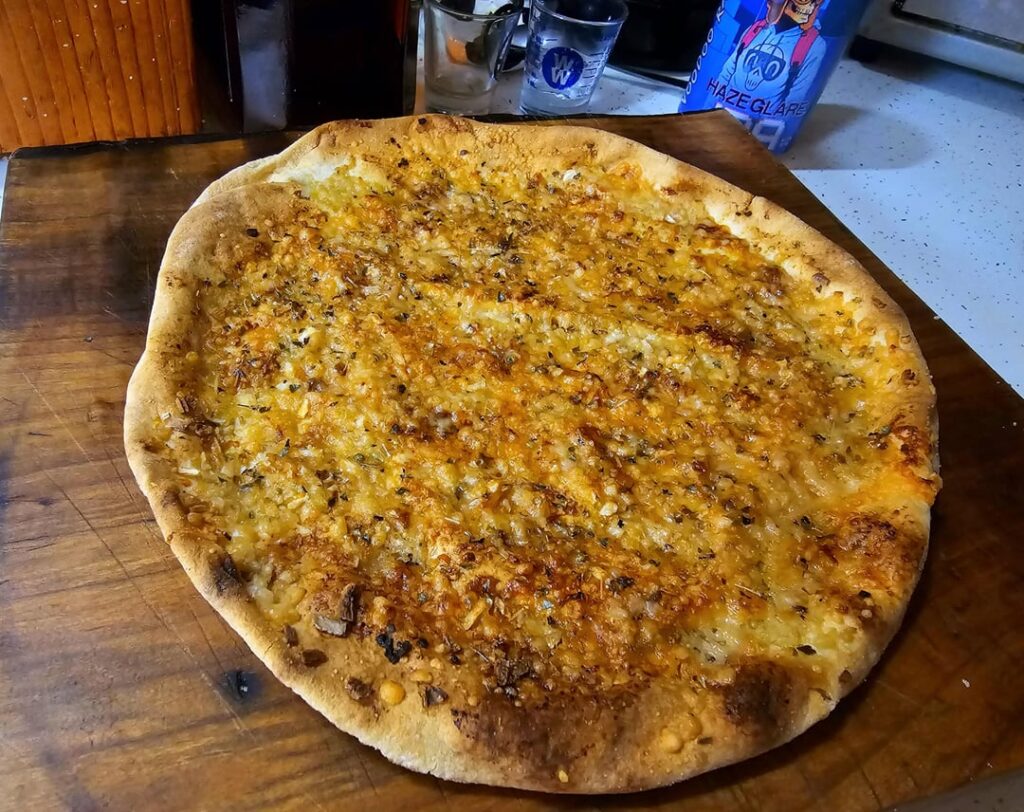 Olive Oil, Garlic, Onion, Hot Sauce, Parmesan, and Oregano on Pita Bread