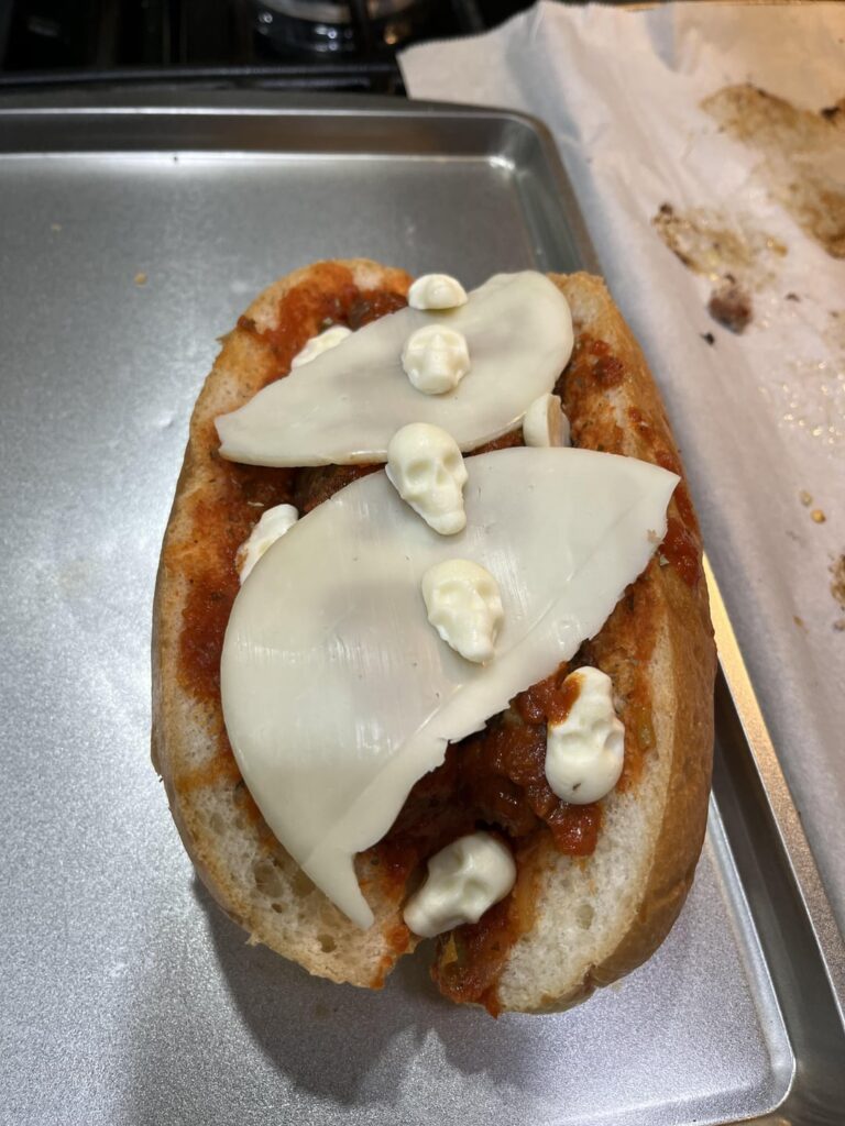 Homemade meatball subs with mozzarella skulls.