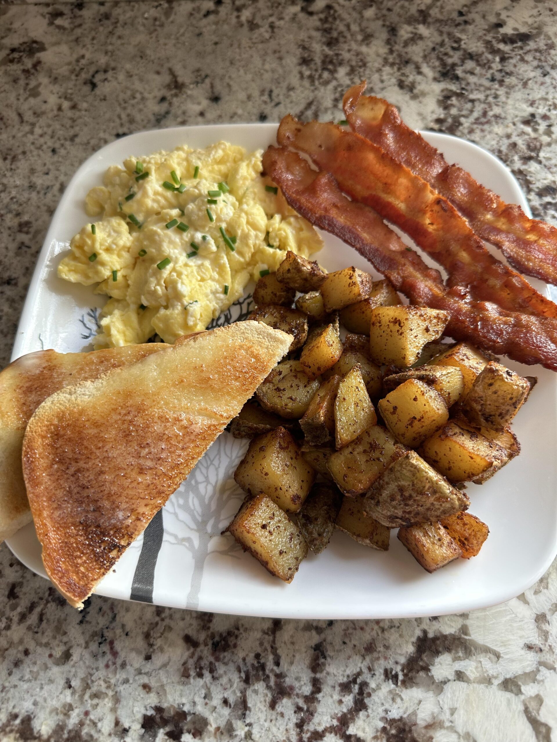 Sour Cream and Chive Scrambled Eggs, Crispy Bacon, Home Fries, and