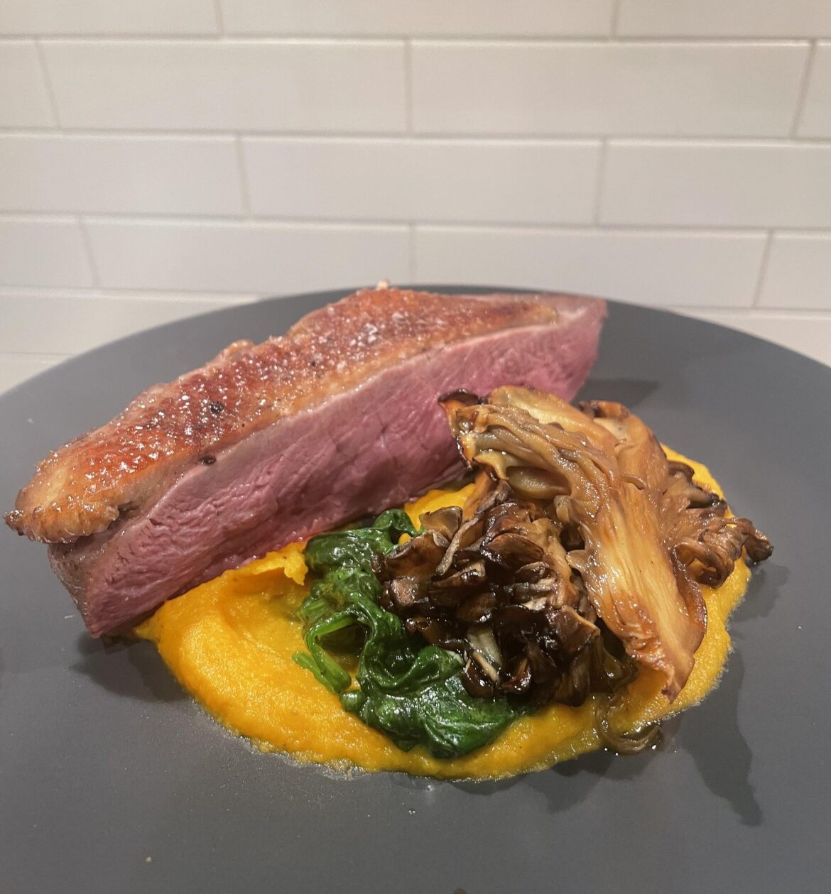 5spice duck breast, sage brown butter sweet potato, creamed spinach, soy maitake