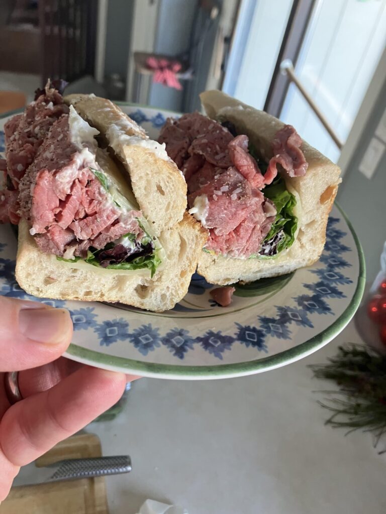 Prime rib, Swiss, homemade horseradish sauce, greens, sourdough baguette. I made a prime rib Saturday night and sandwiching my way through the leftovers