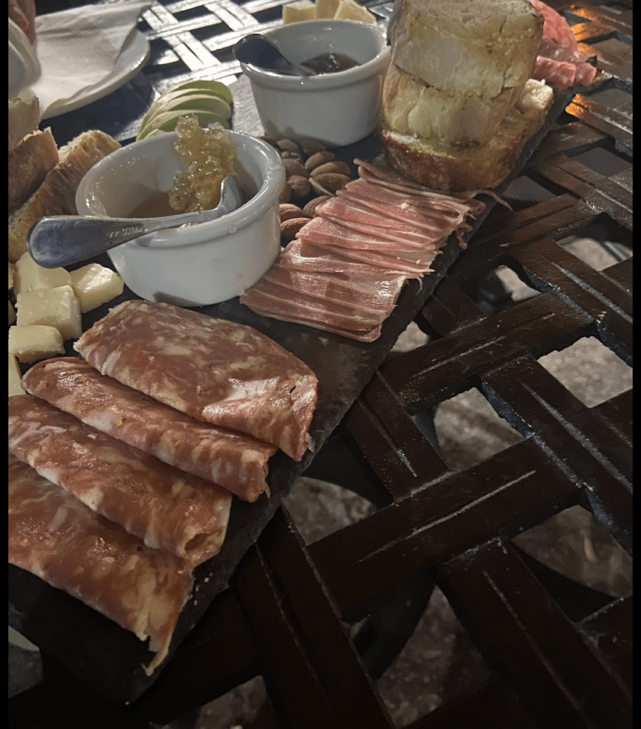 Slate charcuterie on a metal table - a crowd favorite