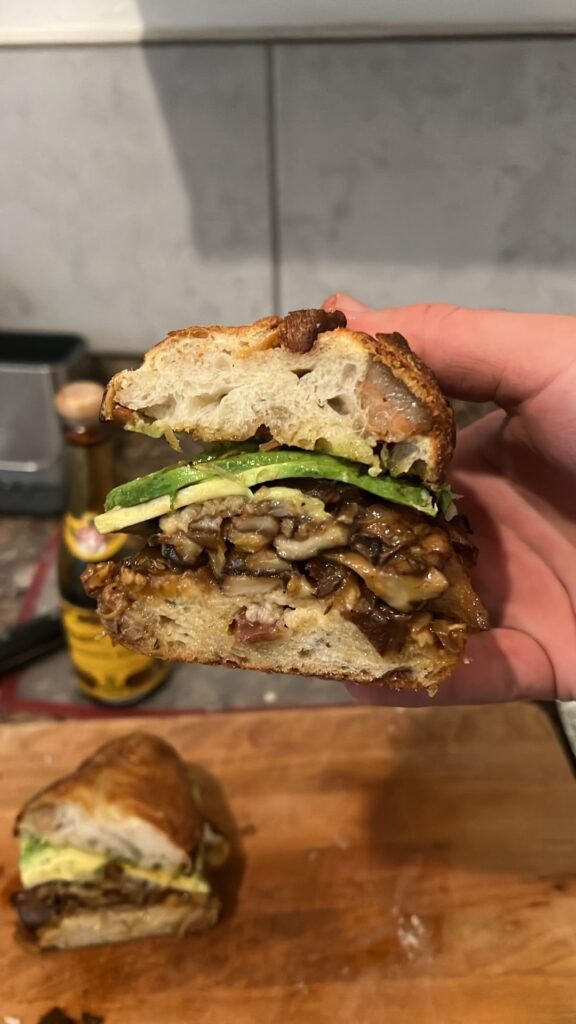 Shiitake mushroom melt on a bacon lardon and Gruyère baguette with midnight moon goat Gouda, medjool date, avocado, and 15yr balsamic