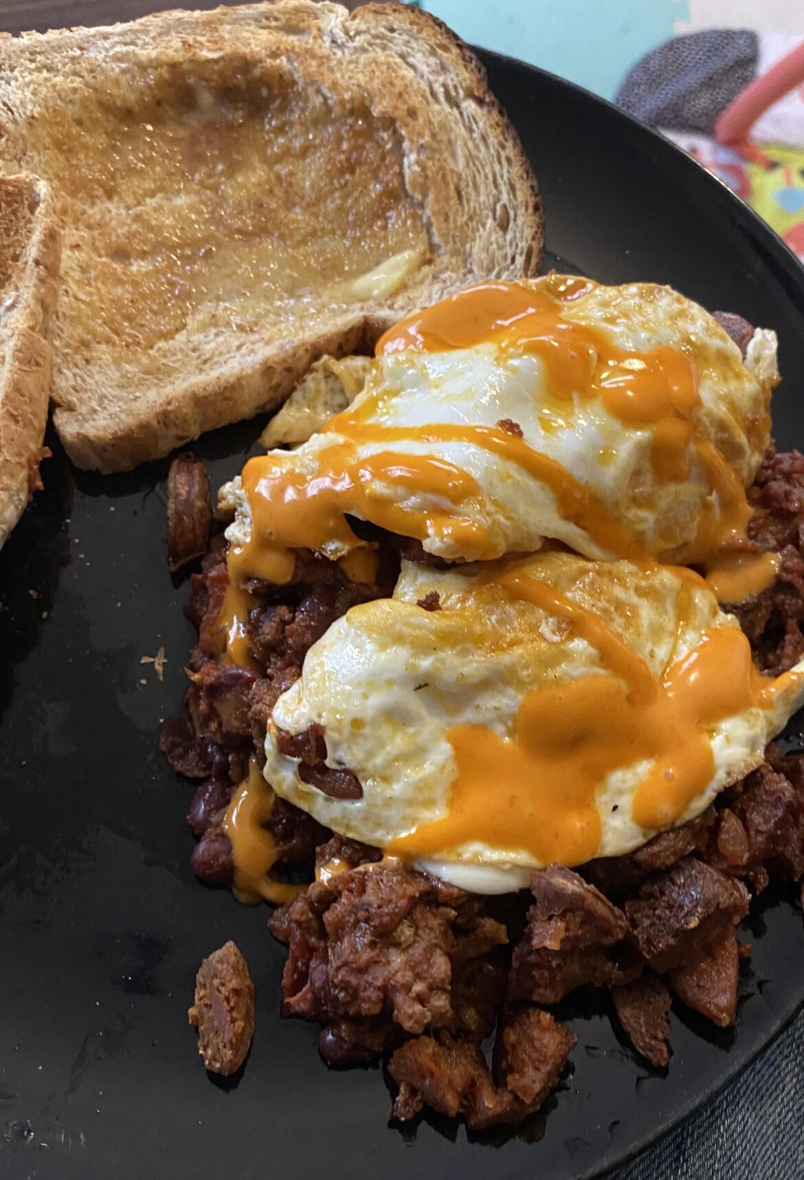 Left over chilli, thew in some chorizo, with two eggs and some sriracha Mayo