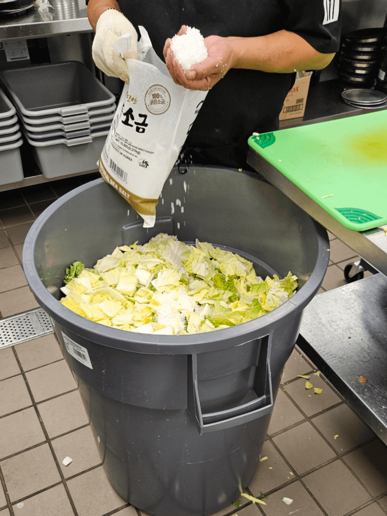 He filled the bin to the brim (cabbage for Kimchi)