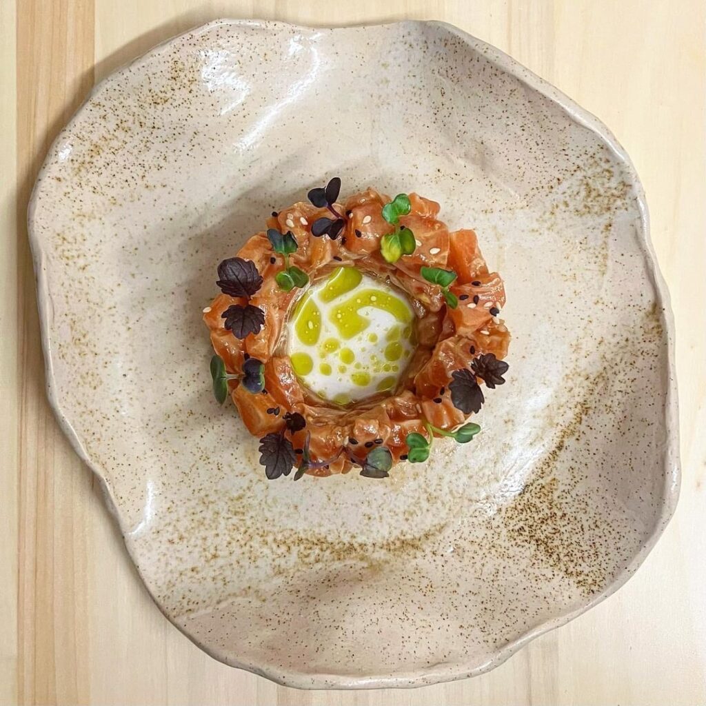 Salmon Tartare marinated in Soy, Lime and Ginger with Coconut Milk and Dill Oil