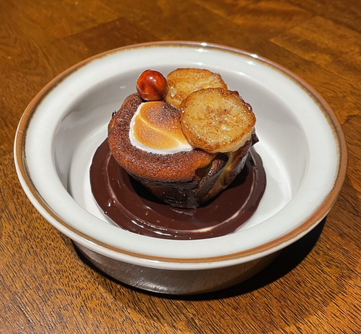 Banana basque cheesecake, warm baileys fudge, italian meringue, caramel bananas, candied hazelnut